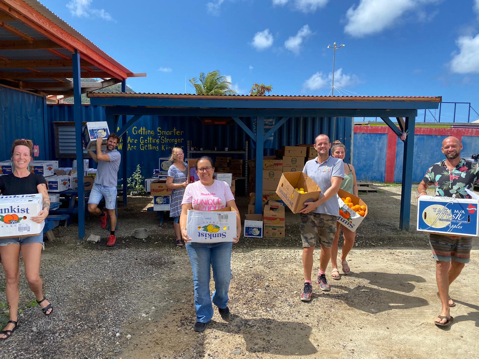 Volunteers hand out thousands of airline meals on Sint Maarten